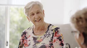 Two ladies talking in kitchen